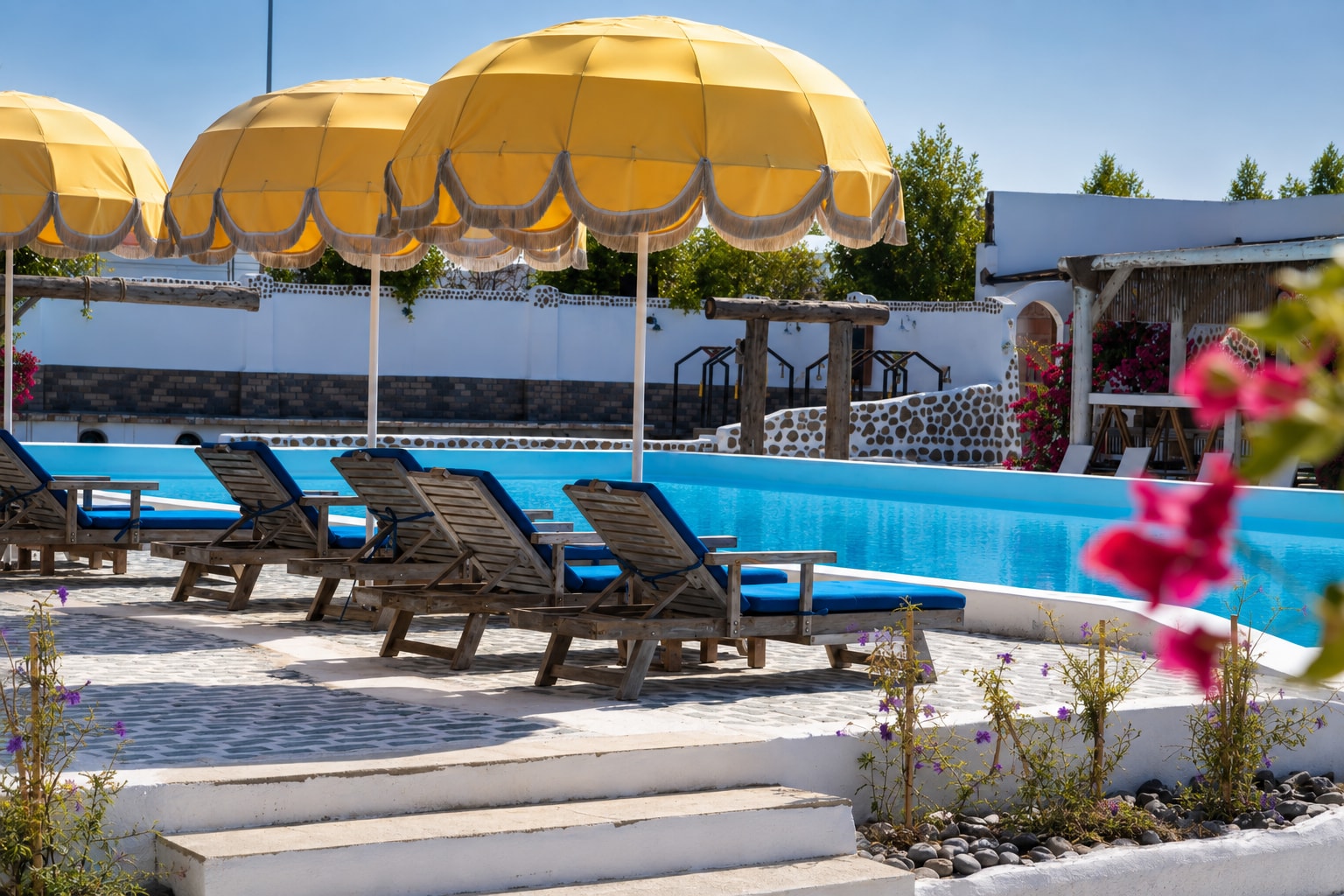 Pool terrace with yellow umbrellas